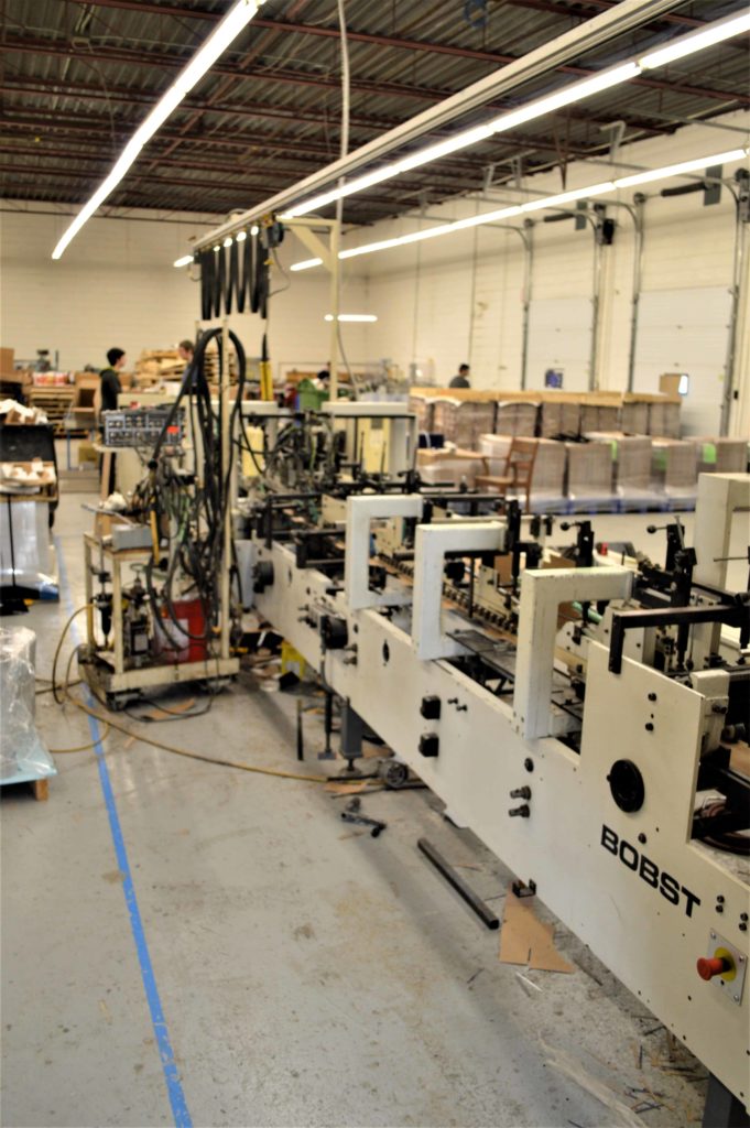 Package folding and gluing machinery