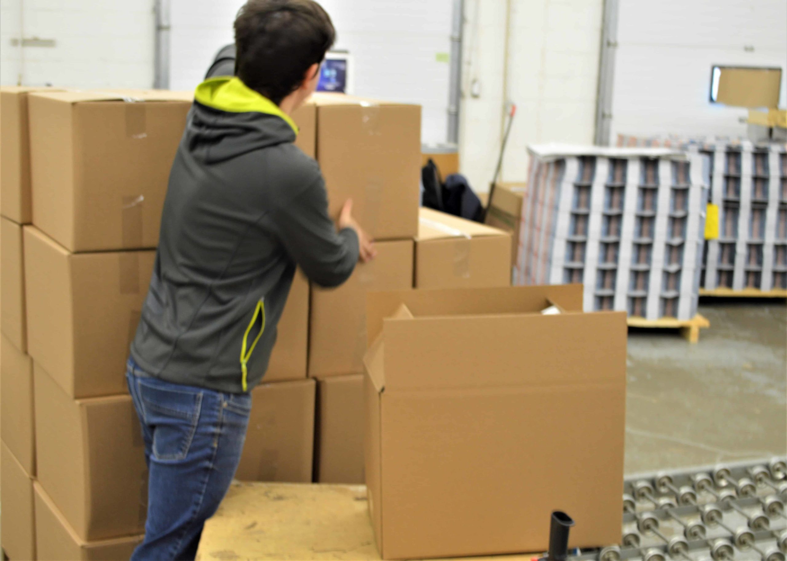 Our team preparing boxes on the factory floor